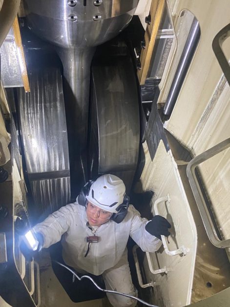 Female marine engineer working on vessel.