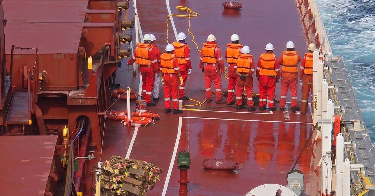 Crew members onboard GENCO MARY preparing during a search and rescue operation coordinated by MRCC Finisterre in challenging sea conditions