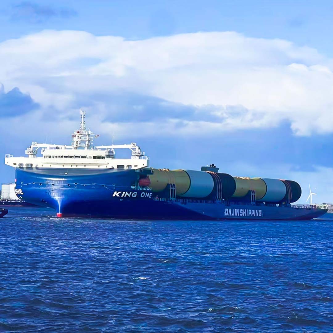 KING ONE heavy lift vessel transporting large offshore wind turbine components at sea.