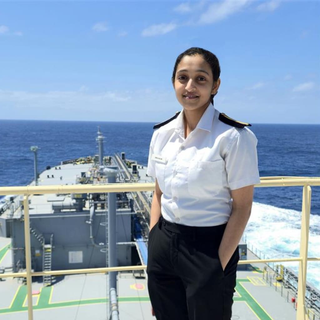 Portrait of Hifa Salim, 5th Engineer for Synergy Marine Group, standing on the deck of the vessel BW Kizoku with the ocean in the background