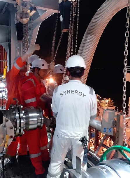 Synergy Marine Group crew, working in boiler suits