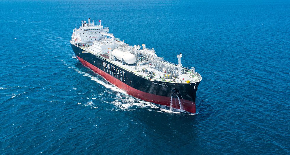 MFM Nicole, a dual-fuel vessel, sailing through open ocean waters.