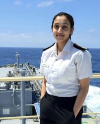 Portrait of Hifa Salim, 5th Engineer for Synergy Marine Group, standing on the deck of the vessel BW Kizoku with the ocean in the background.