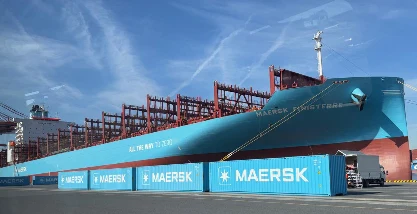 Methanol dual-fuel container vessel Maersk Finisterre docked at port, managed by Synergy Marine Group.