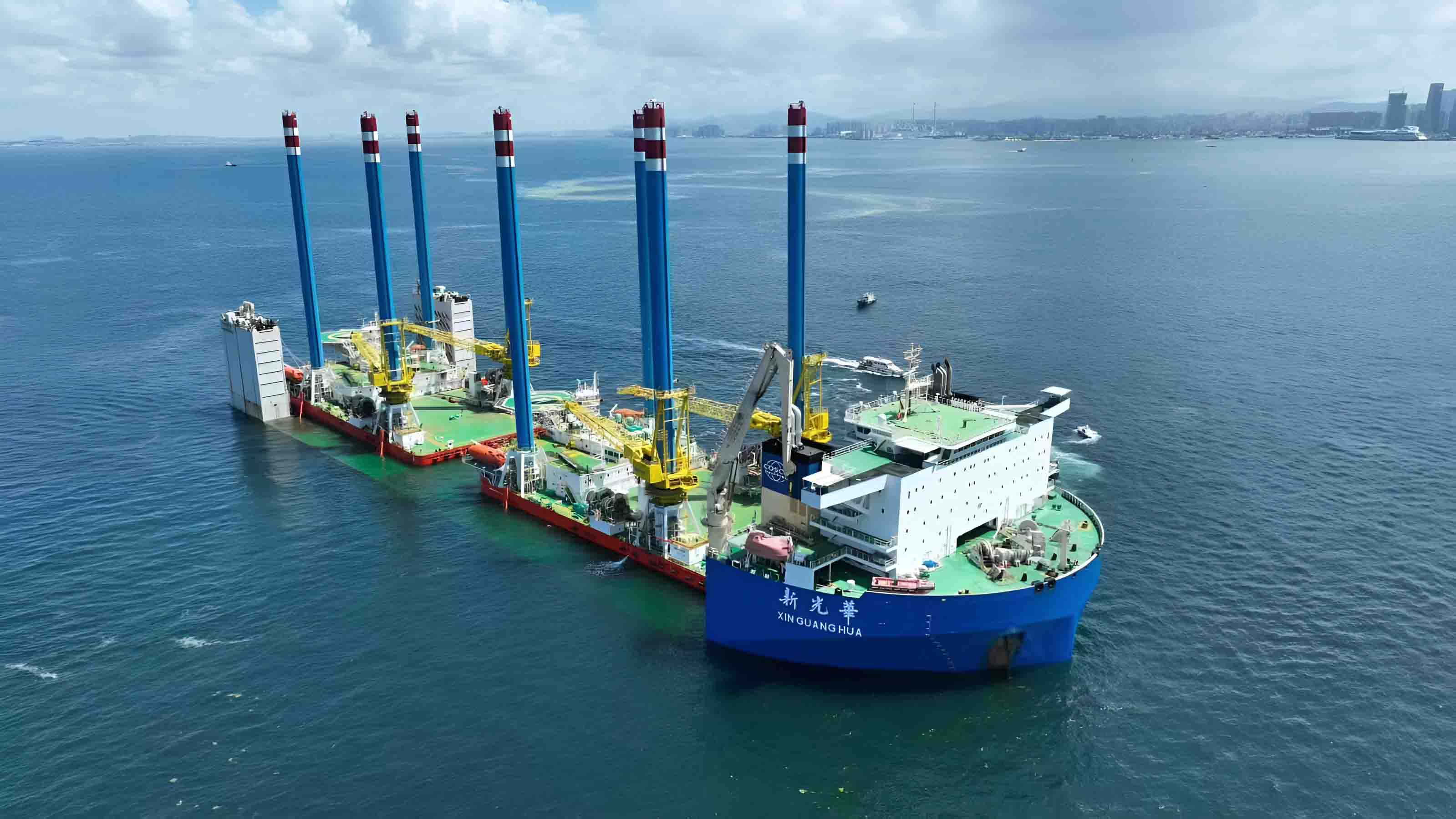 Aerial view of the heavy lift offshore vessel Xin Guang Hua at sea, demonstrating specialized offshore vessel management capabilities.