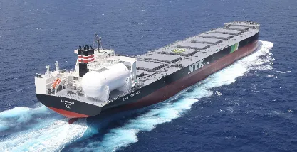 High-angle view of the Japan-flagged LNG dual fuel Newcastlemax bulk carrier SG Horizon in open water.